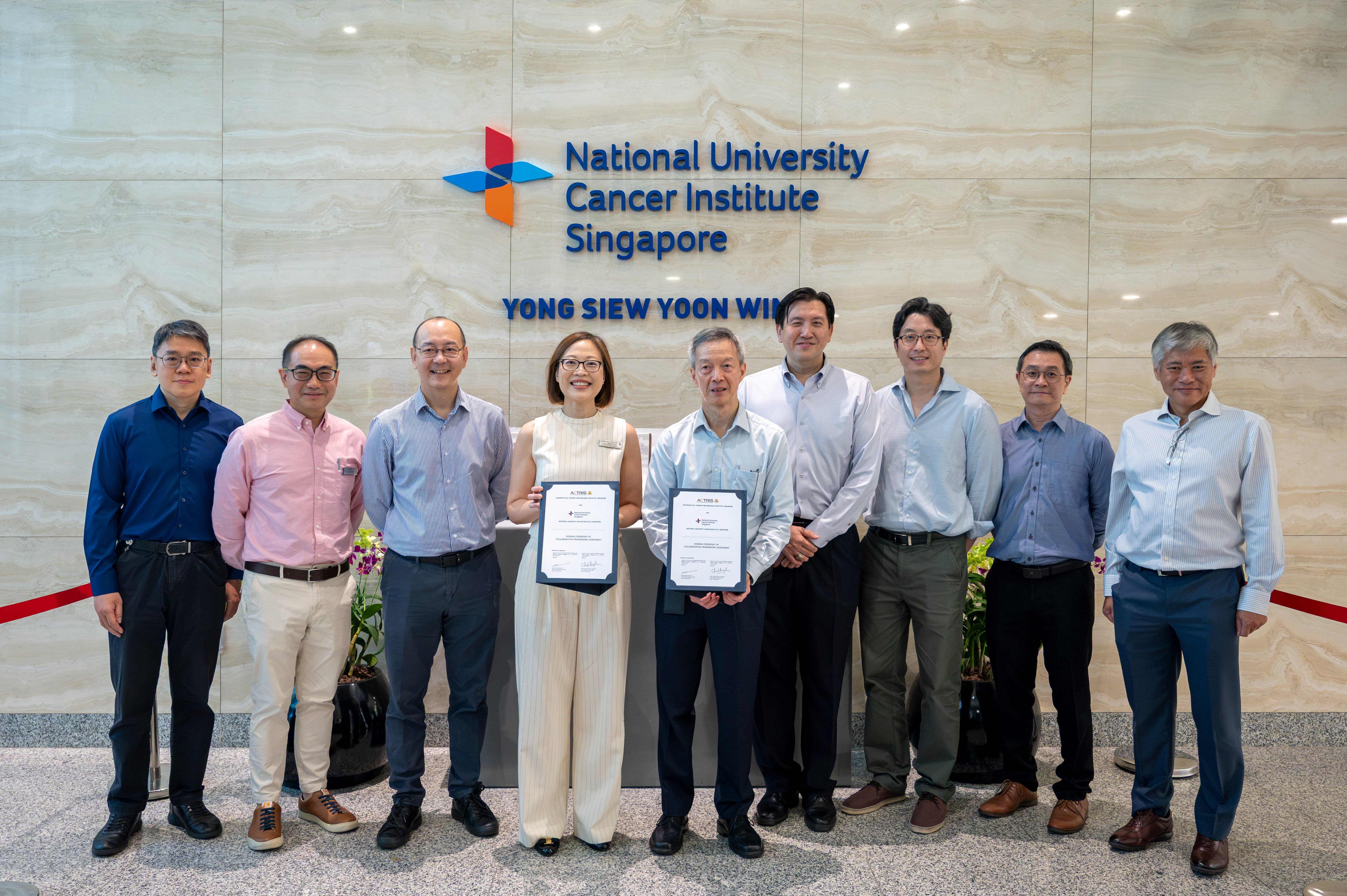 ACTRIS and NCIS representatives commemorating the signing of an MOU